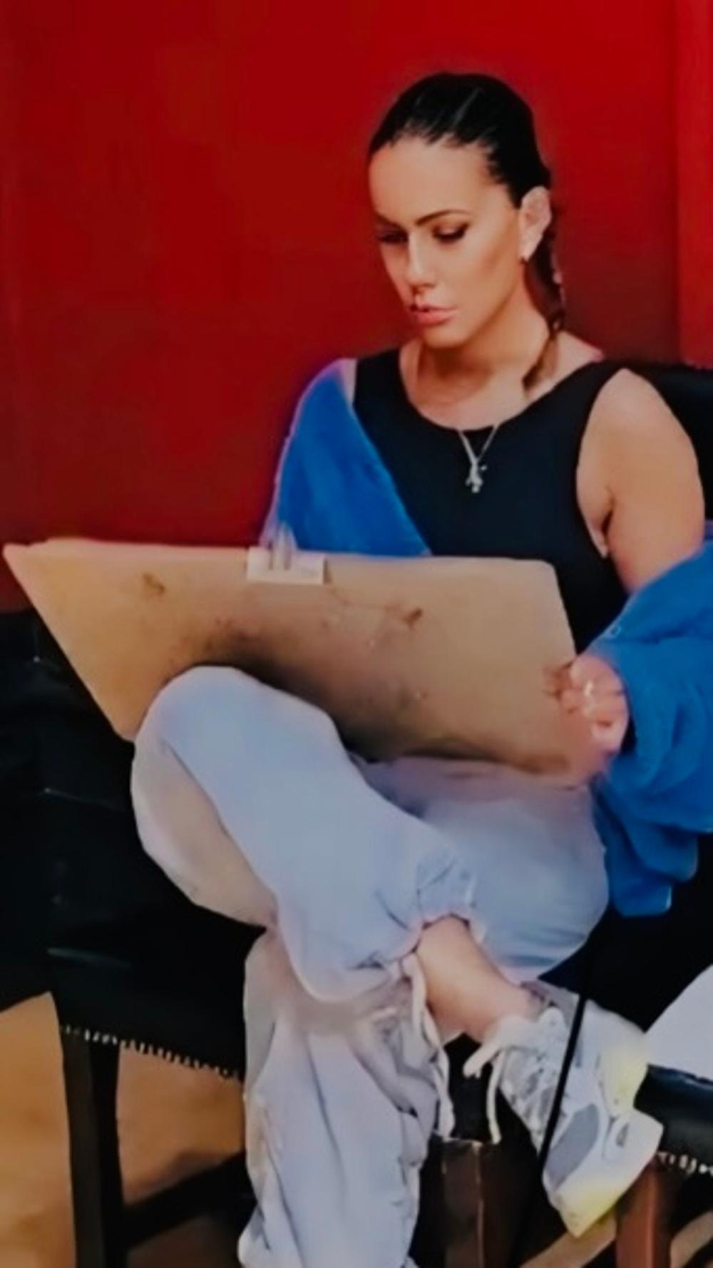 A participant sketching on a drawing board